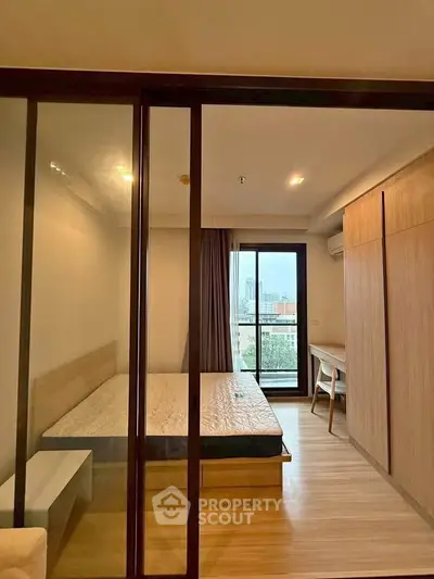 Modern bedroom with balcony view in urban apartment