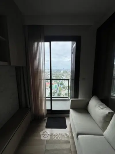 Modern living room with balcony offering stunning city view