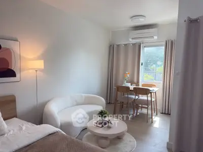 Chic studio apartment with cozy living area and dining space, perfect for modern living.