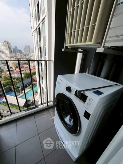 Modern balcony with washing machine and city view, perfect for urban living.