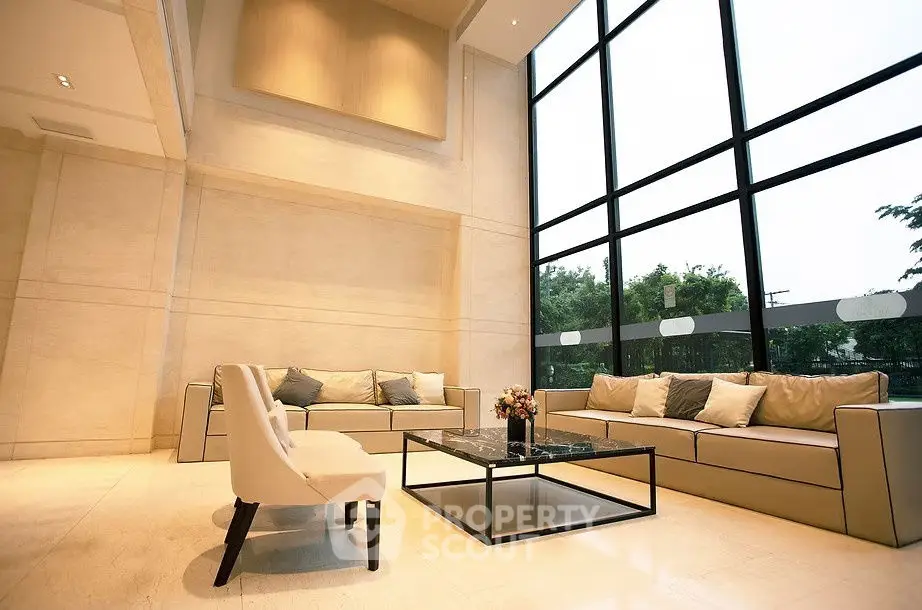 Luxurious modern living room with high ceilings and large windows