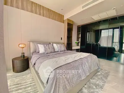 Luxurious modern bedroom with elegant decor and ample natural light