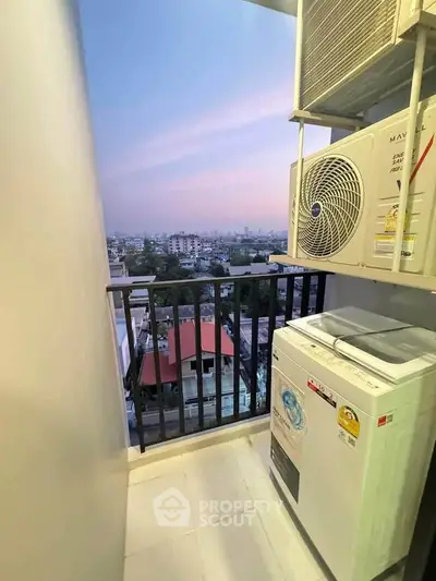 Charming balcony with city view and modern appliances, perfect for urban living.
