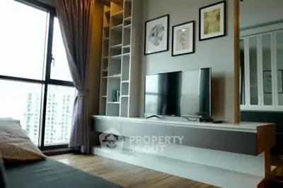 Modern living room with large window and stylish decor