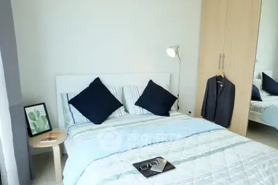 Cozy bedroom with modern decor and ample natural light