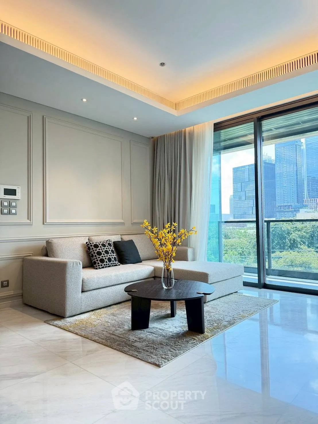 Luxurious living room with modern sofa and city view balcony, perfect for urban living.