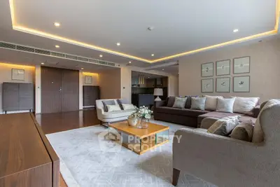 Spacious modern living room with elegant decor and open kitchen layout