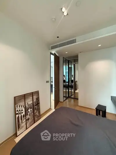 Modern bedroom with stylish decor and large mirror closet doors