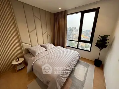 Modern bedroom with city view, stylish decor, and cozy ambiance
