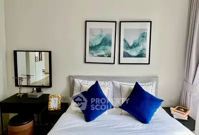 Elegant bedroom with modern decor and stylish artwork above bed