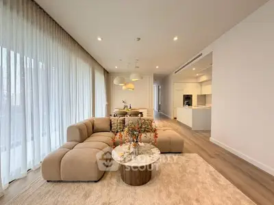 Spacious modern living room with open kitchen and elegant decor
