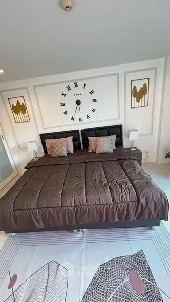 Luxurious bedroom with stylish decor and large bed, perfect for relaxation.