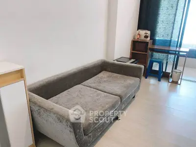 Cozy living room with modern gray sofa and stylish decor