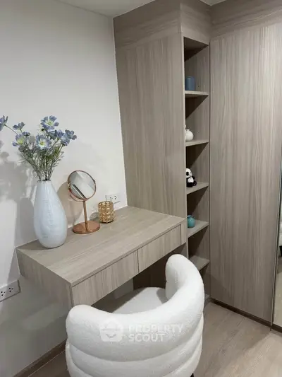 Modern study nook with elegant wood finish and plush chair, perfect for a stylish home office setup.