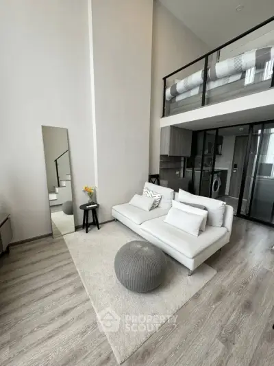 Modern loft apartment with stylish living area and mezzanine bedroom