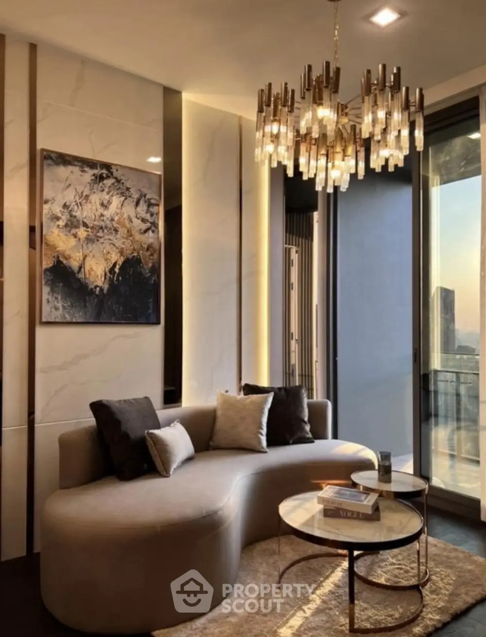 Luxurious living room with elegant chandelier and modern decor, featuring a stunning city view.