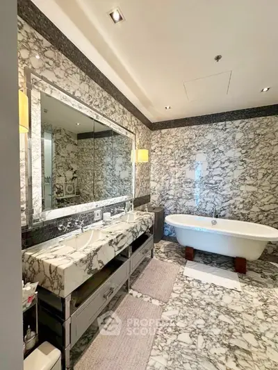 Luxurious marble bathroom with double sinks and freestanding bathtub