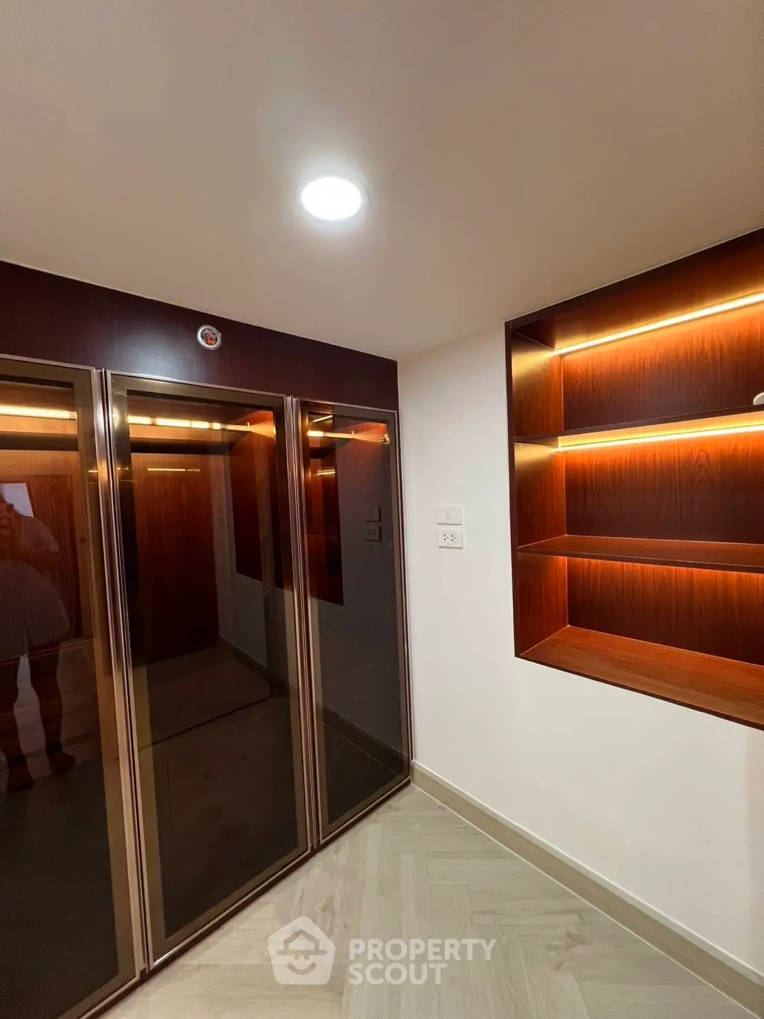Modern elevator lobby with sleek design and ambient lighting