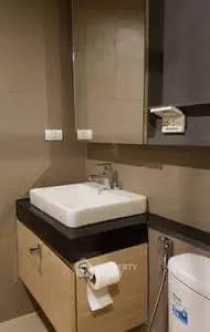 Modern bathroom with sleek sink and stylish cabinetry