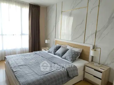 Luxurious bedroom with modern decor and ample natural light