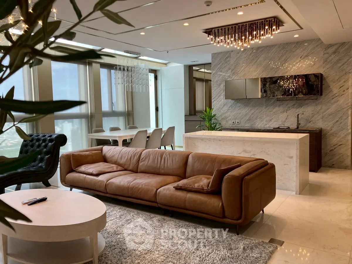 Luxurious open-plan living room with modern kitchen and elegant decor