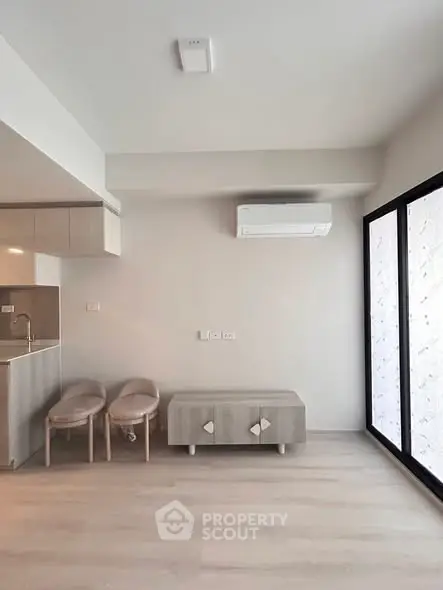Modern minimalist living room with sleek furniture and air conditioning