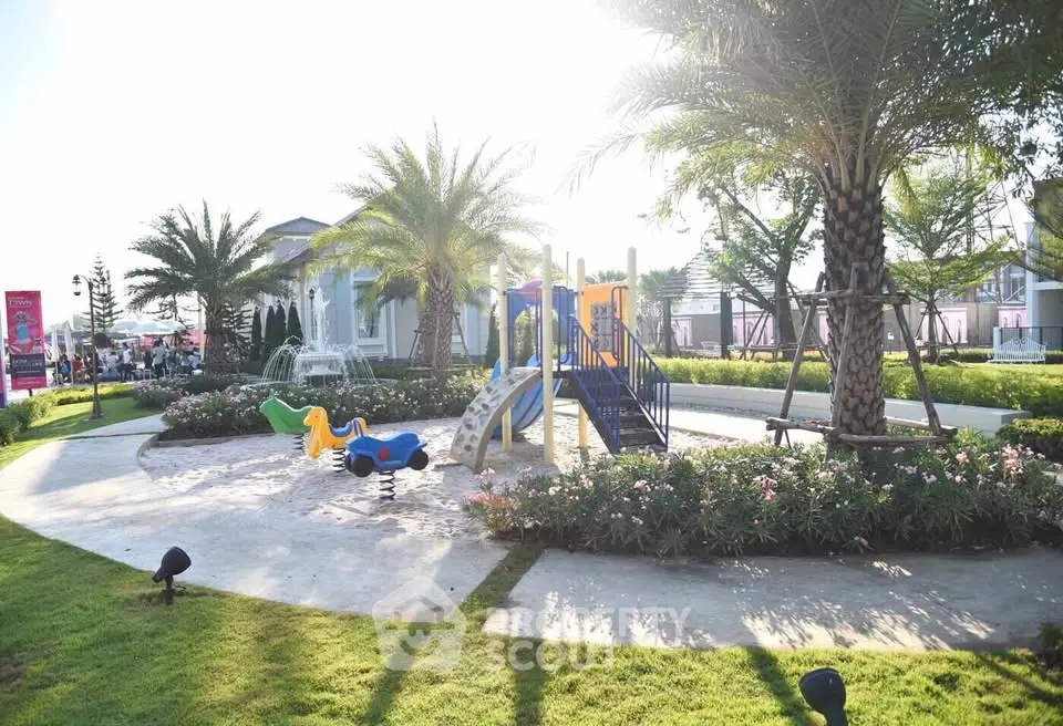 Charming garden with playground in a serene residential community, perfect for family living.