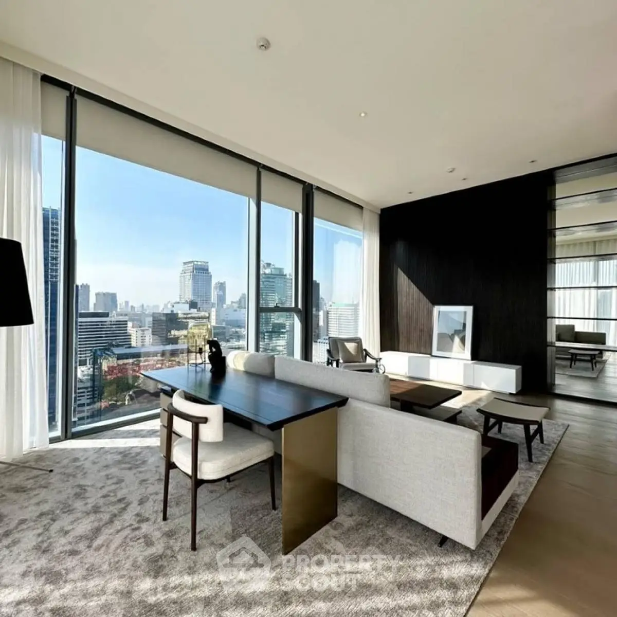 Luxurious modern living room with panoramic city view and elegant furniture