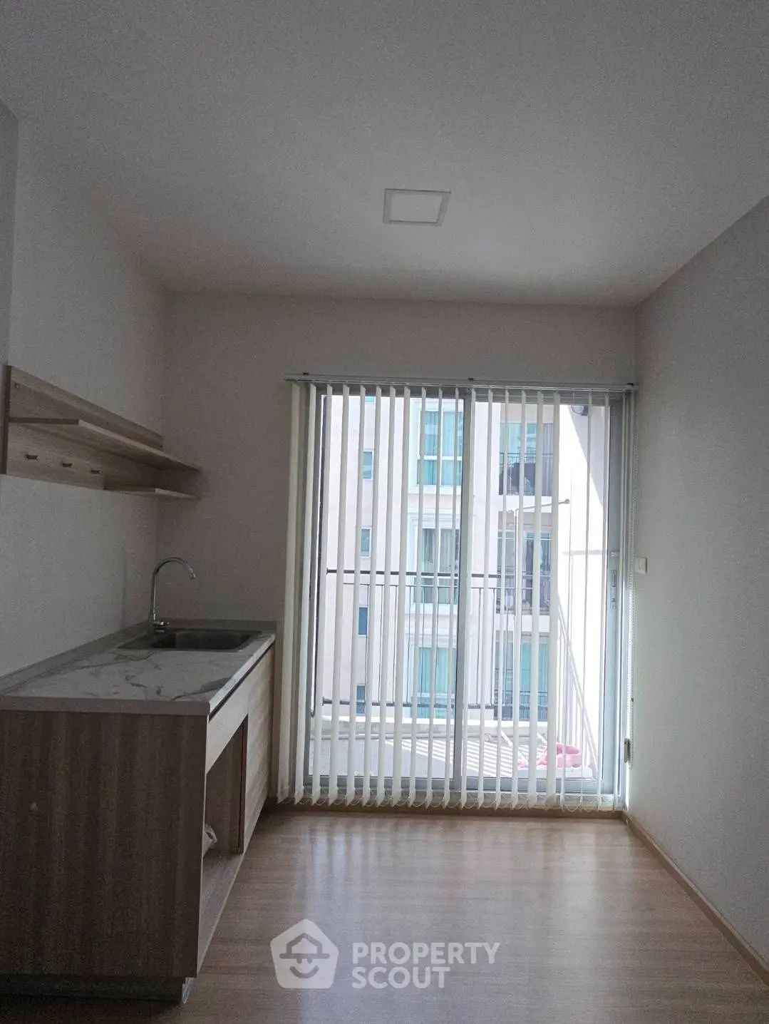 Modern minimalist kitchen with natural light and sleek cabinetry