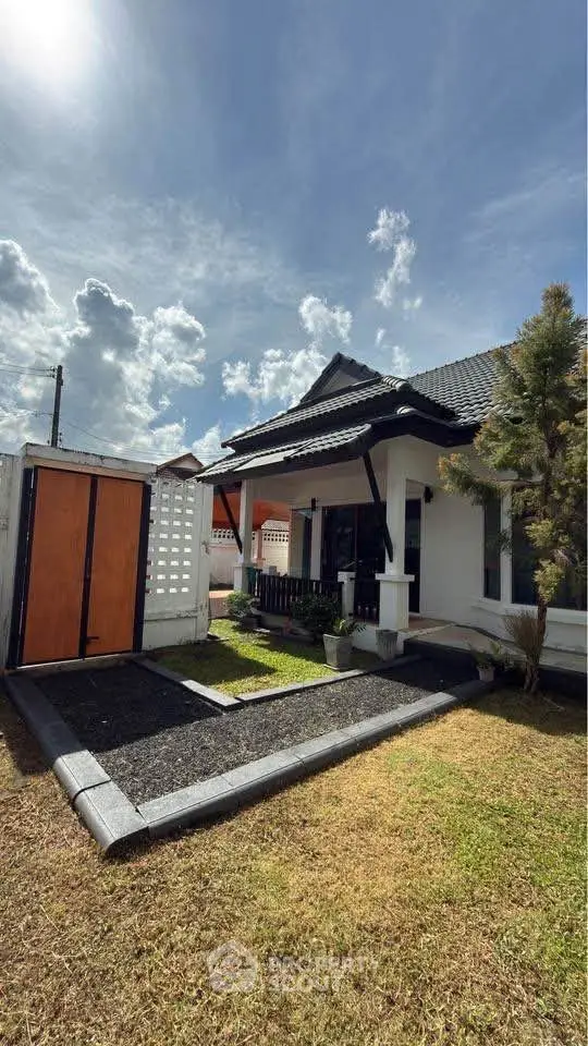 Charming single-story home with modern design and lush garden, perfect for family living.