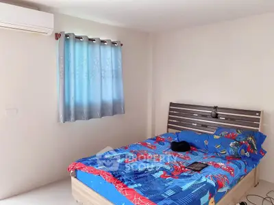 Cozy bedroom with air conditioning and colorful bedding