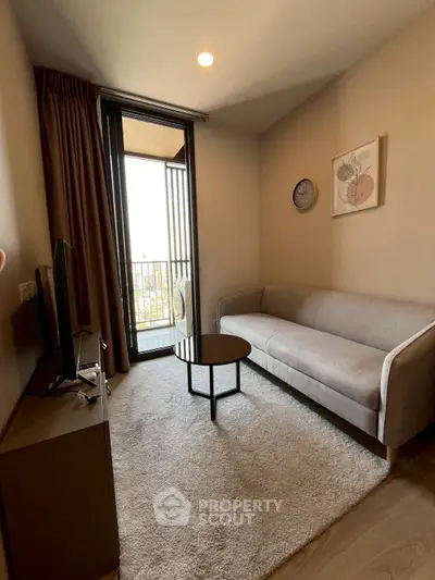 Cozy living room with modern sofa and balcony access in stylish apartment