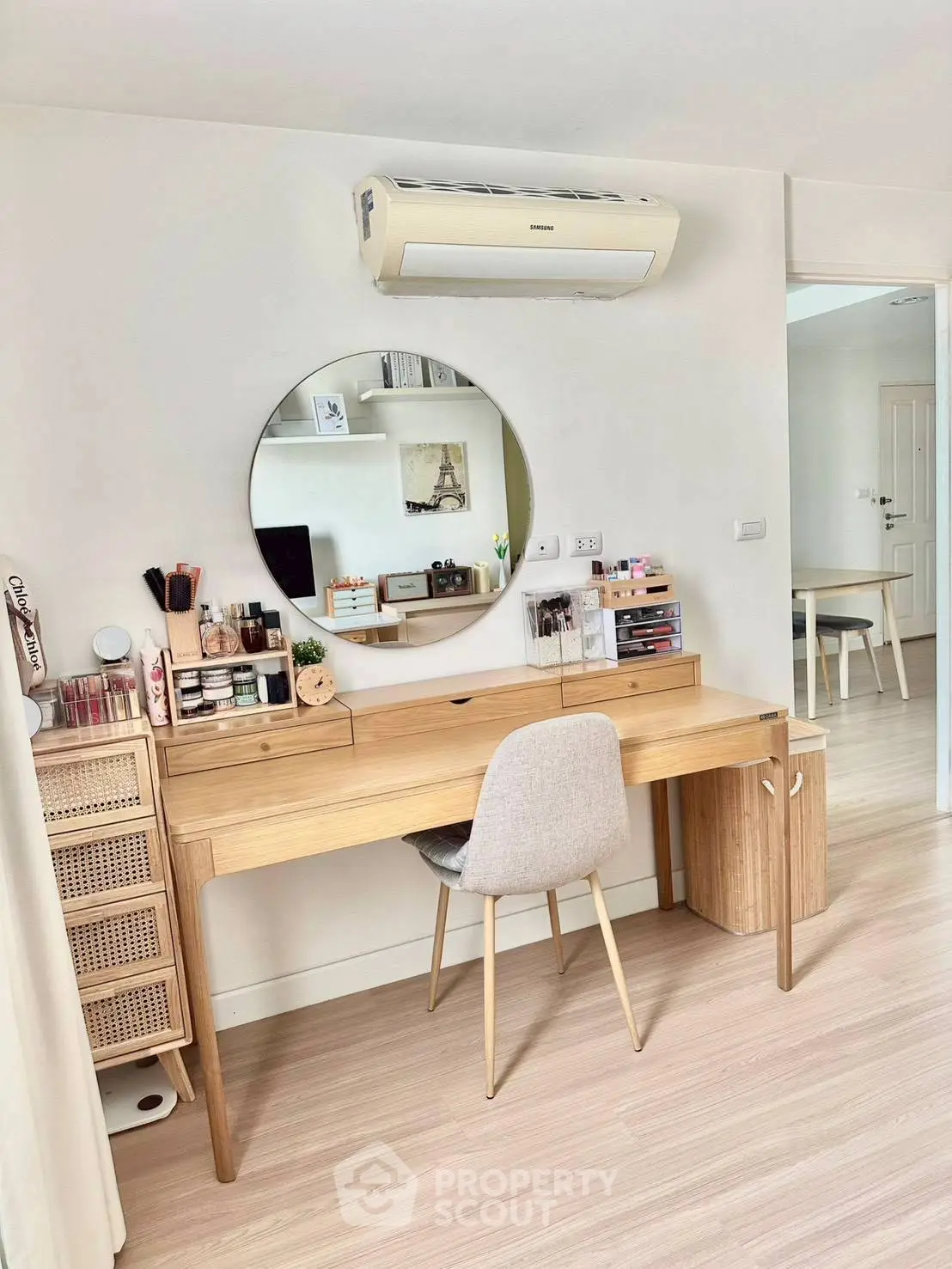 Stylish study area with modern desk and mirror in a bright apartment