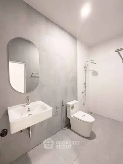 Modern minimalist bathroom with sleek fixtures and neutral tones