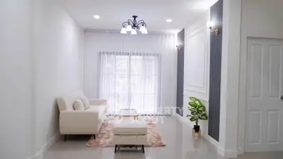 Elegant living room with modern decor and natural light