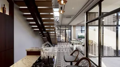 Luxurious modern interior with stylish staircase and pool table, perfect for entertainment and relaxation.