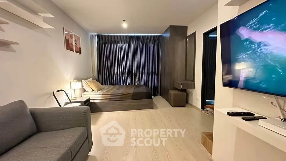 Modern studio apartment with cozy living area and stylish decor
