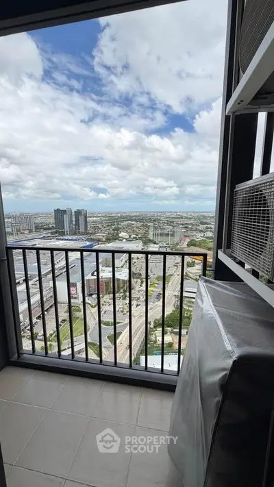 Stunning high-rise balcony view overlooking cityscape with expansive skyline and modern architecture.