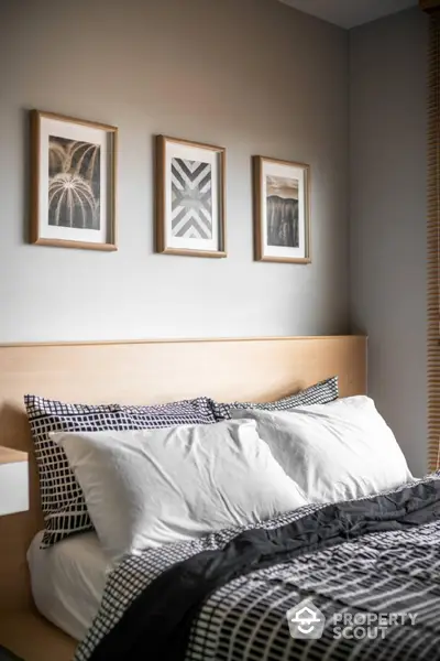 Modern bedroom with stylish decor and cozy bedding in a contemporary home.