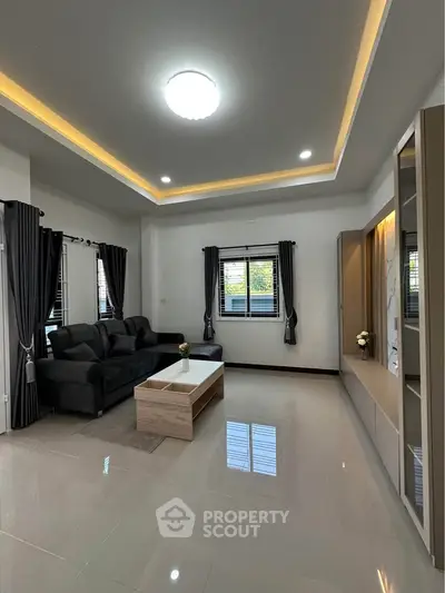 Modern living room with sleek furniture and elegant lighting
