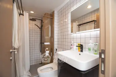 Modern bathroom with sleek fixtures and stylish lighting