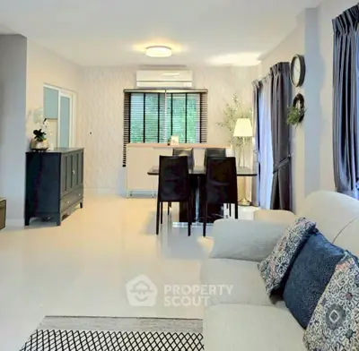Spacious modern living room with elegant dining area and stylish decor