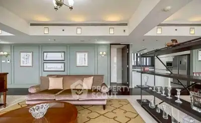 Luxurious living room with elegant decor and open kitchen layout in modern apartment.