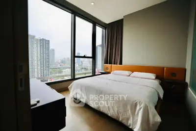 Modern bedroom with stunning city view and large windows