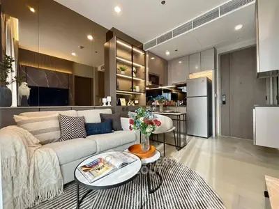 Modern living room with stylish decor and open kitchen layout