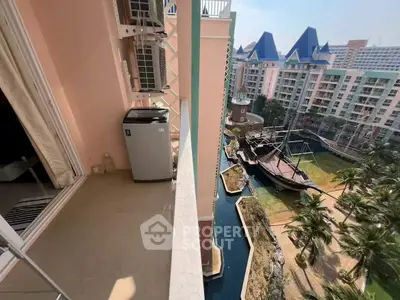 Stunning balcony view overlooking a unique pirate ship-themed garden in a modern residential complex.