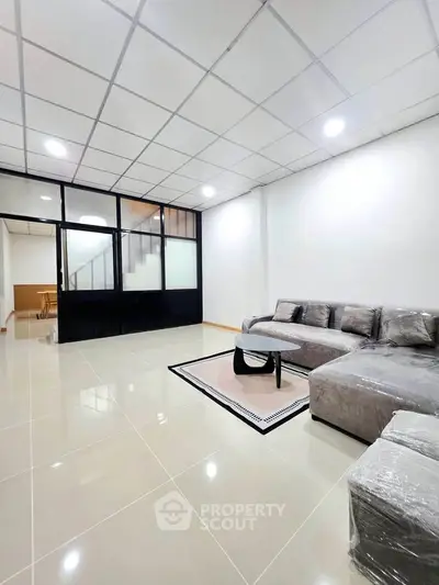 Spacious modern living room with sleek design and comfortable seating