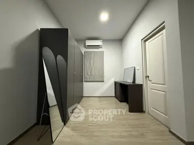 Minimalist bedroom with sleek wardrobe and modern decor