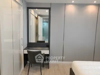 Modern bedroom with sleek design and built-in vanity mirror