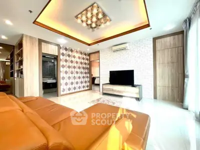 Spacious modern living room with stylish decor and ample natural light